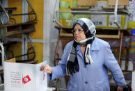 A Tunisian votes in the second round of the legislative elections in Tunis, Sunday, Jan. 29, 2023. Tunisia's president and its shaky democracy are facing an important test Sunday as voters cast ballots in the second round of parliamentary elections. Turnout was just 11% in the first round of voting last month. (AP Photo/Hassene Dridi)