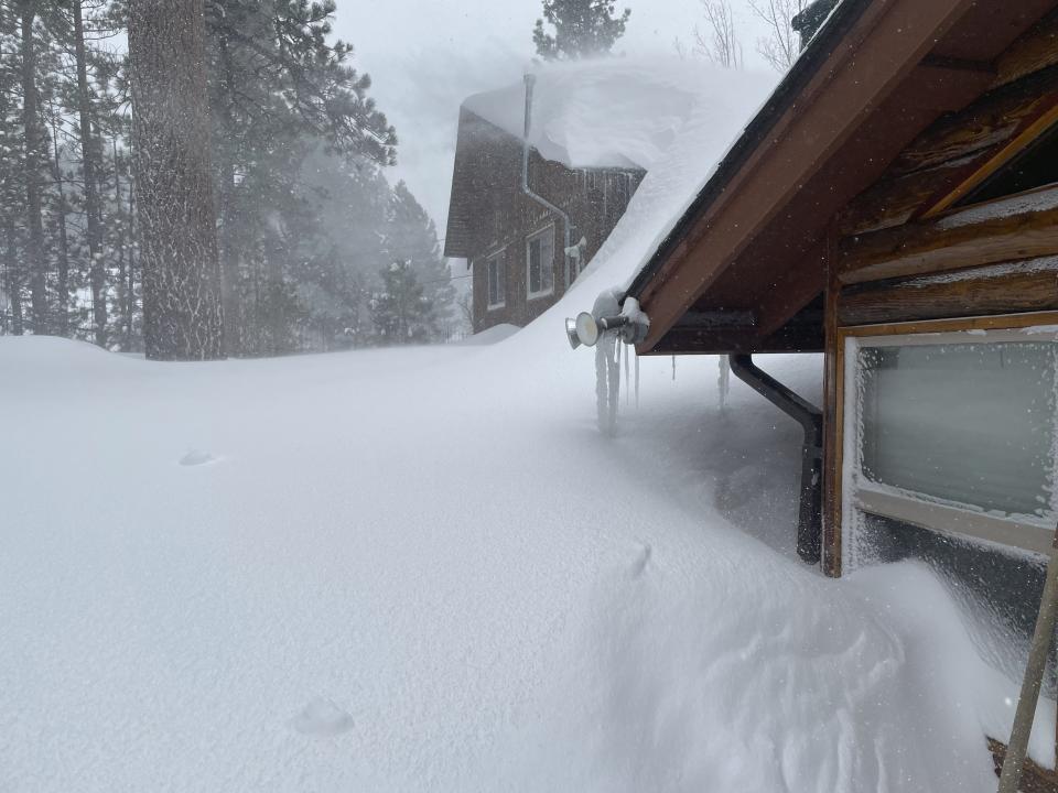 David and Kelli Góra 's home is covered after a snowstorm in Big Bear Lake, Calif., on Wednesday, March 1, 2023. (David Góra via AP)