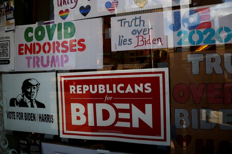 Signs in support of U.S. Democratic presidential candidate Joe Biden hang in the window of the Democratic headquarters in Union City, Pennsylvania