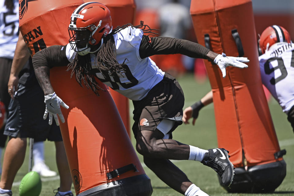 Cleveland Browns defensive linemen Jadeveon Clowney (90) participates in a drill during an NFL football practice at the team's training facility, Thursday, June 17, 2021, in Berea, Ohio. (AP Photo/David Dermer)