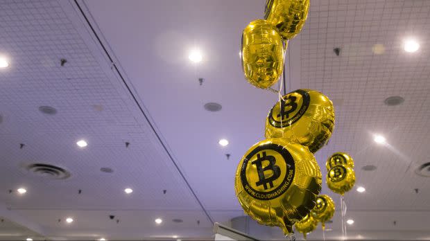 An image of bitcoin themed balloons float in the air during the "Inside Bitcoins: The Future of Virtual Currency Conference" in New York