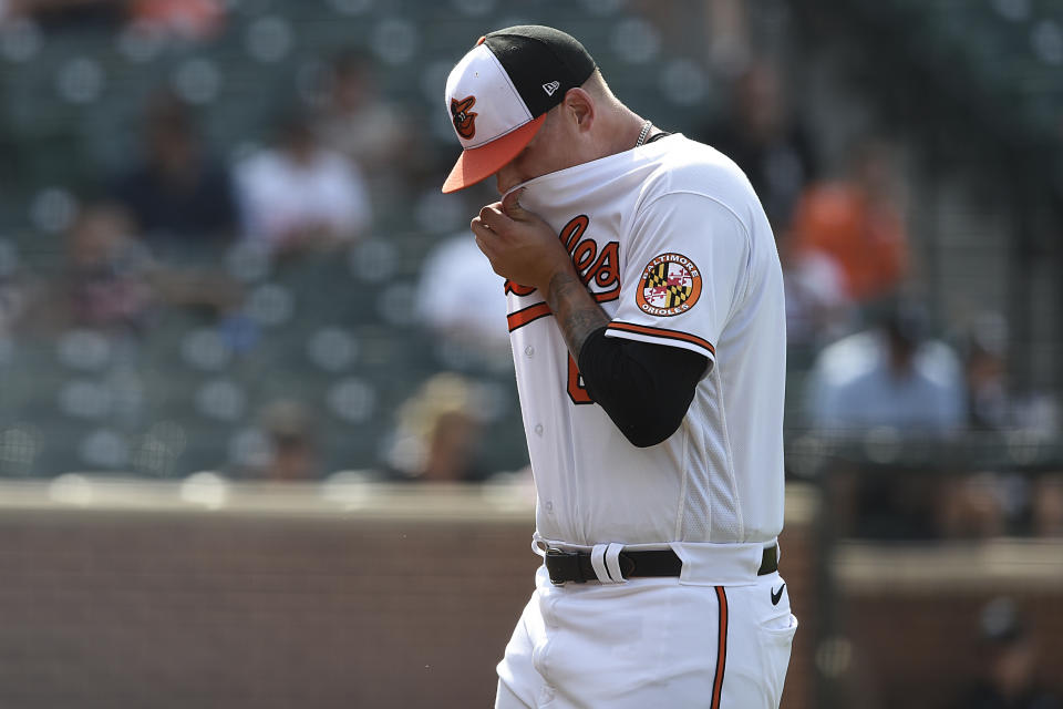 Baltimore Orioles pitcher Tyler Wells leaves the pitchers mound after giving up a three-run home run to the Chicago White Sox In the 10th inning of a baseball game, July 11, 2021 in Baltimore.(AP Photo/Gail Burton)