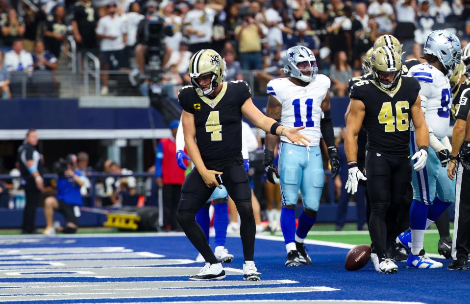 Sep 15, 2024; Arlington, Texas, USA; New Orleans Saints quarterback Derek Carr (4) celebrates after scoring a touchdown during the first half against the Dallas Cowboys at AT&T Stadium. Mandatory Credit: Kevin Jairaj-Imagn Images