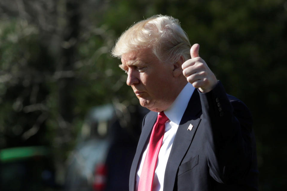 U.S. President Donald Trump thumbs up as he walks on the South Lawn of the White House in Washington, U.S., en route to CPAC, February 24, 2017. (Photo: REUTERS/Yuri Gripas)