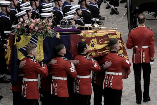 Queen Elizabeth's coffin, draped in the Royal Standard, is placed onto the State Gun Carriage of the Royal Navy. (Photo: NARIMAN EL-MOFTY via Getty Images)