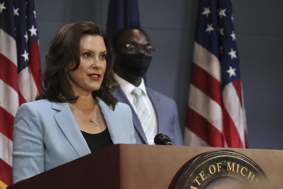 FILE -This July 9, 2020 file photo provided by the Michigan Office of the Governor shows Michigan Gov. Gretchen Whitmer as she addresses the state during a speech in Lansing, Mich. Gov. Whitmer on Friday, July 10, 2020, toughened a requirement to wear masks during the coronavirus pandemic, mandating that businesses open to the public deny service or entry to customers who refuse to wear one. The governor also expanded where people must have a face covering beyond indoor public spaces. Starting immediately, they have to wear one outdoors if they cannot consistently keep 6 feet from non-household members, and while using public transportation, a taxi or a ride-sharing vehicle — with some exceptions. (Michigan Office of the Governor via AP, Pool)