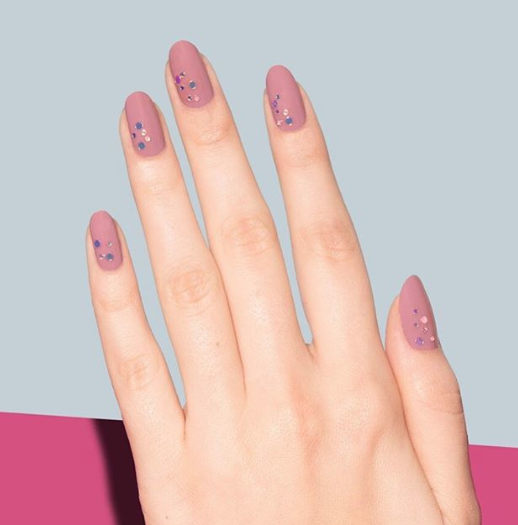 <p>Dainty sequins in the corners of the nail add dimension to the dusty rose matte polish. Texture? Check. Color? Check. Chicness? Check. </p><p><em>Design by <a href="https://www.instagram.com/p/BsKCmOnHkxc/" rel="nofollow noopener" target="_blank" data-ylk="slk:@paintbox;elm:context_link;itc:0;sec:content-canvas" class="link ">@paintbox</a></em></p>