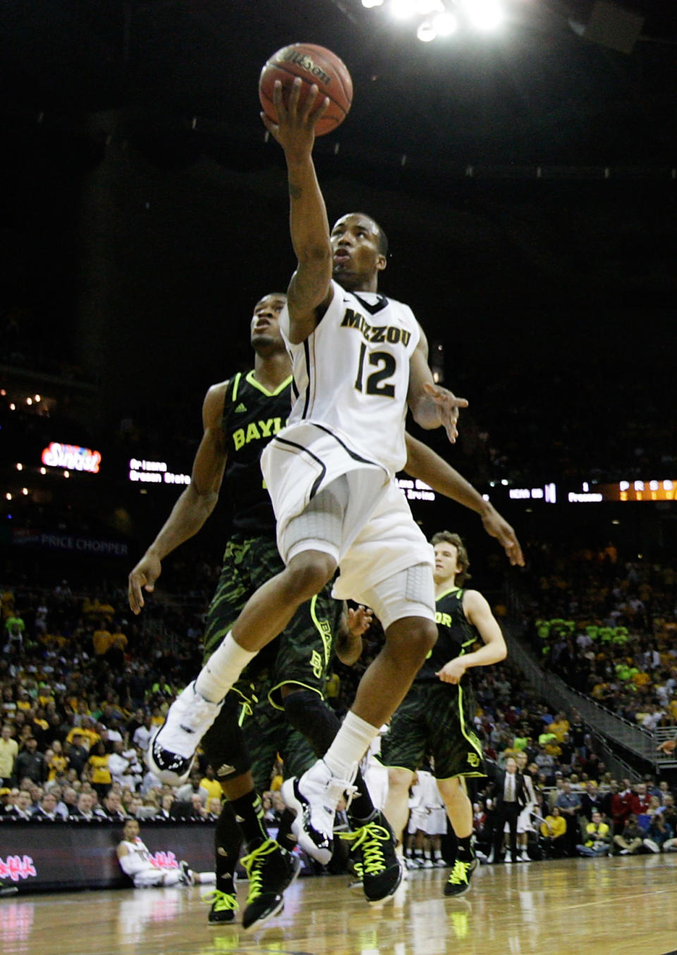 KANSAS CITY, MO - MARCH 10: Marcus Denmon #12 of the Missouri Tigers shoots against the Baylor Bears during the championship game of the 2012 Big 12 Men's Basketball Tournament at Sprint Center on March 10, 2012 in Kansas City, Missouri. (Photo by Jamie Squire/Getty Images)