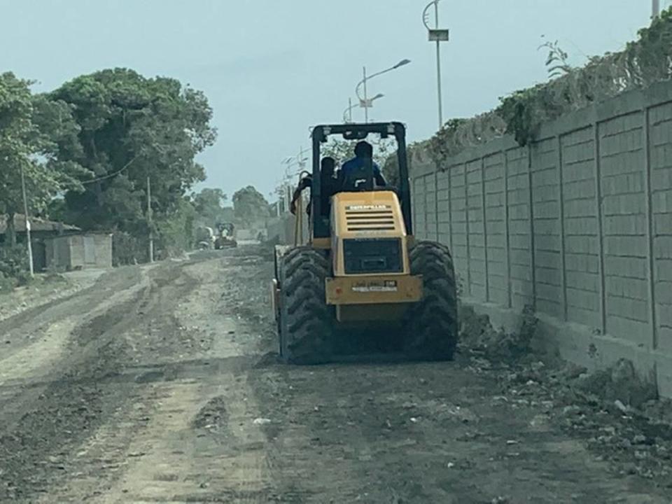 Workers prepare an unpaved road on Wednesday, July 21, 2021, for guests who will be attending the funeral of the late Haiti President Jovenel Moïse at his family’s walled-in residence on the outskirts of the northern port city of Cap-Haïtien, Haiti, on Friday, July 23.