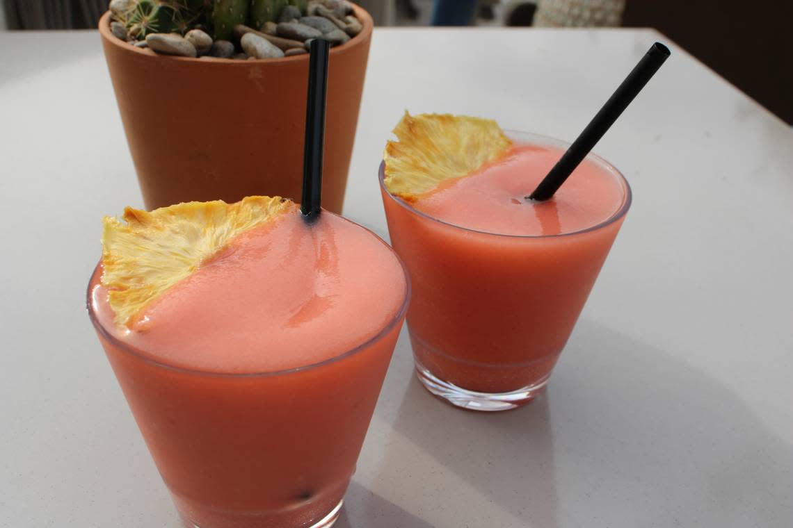 Texas Sun frozen cocktails. Granished with dried pineapple. Perfect consistency to sip through a straw.