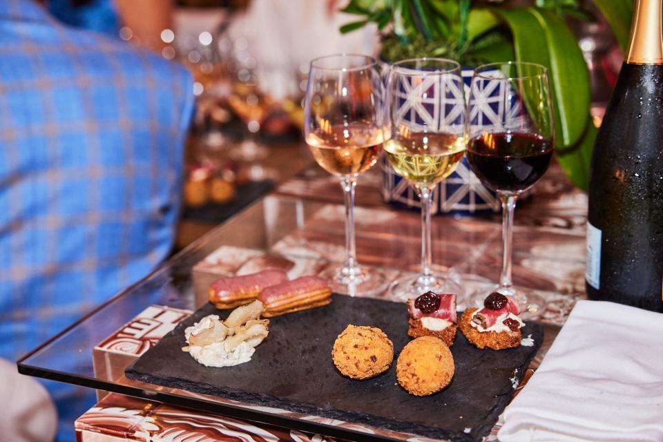 Bites and sips are offered during a 2022 Palm Beach Food & Wine Festival tasting event.