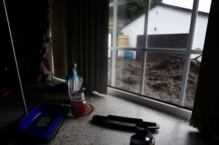 Mud is seen outside the window of Bernie Kearney's kitchen at her home, destroyed by a landslide, after torrential rains in Urris, County Donegal, Ireland August 24, 2017. REUTERS/Clodagh Kilcoyne