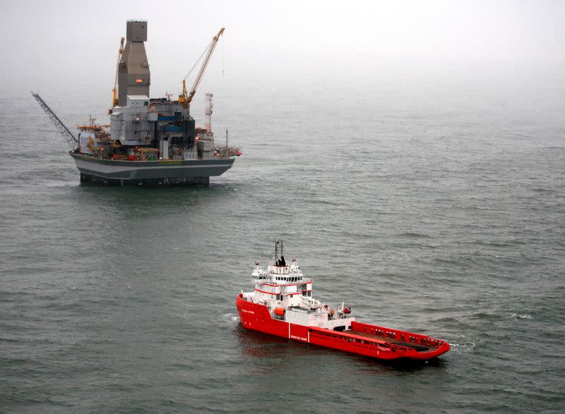 FILE PHOTO: A vessel leaves the Orlan oil platform at Sakhalin-1's off-shore rig at the Chaivo field