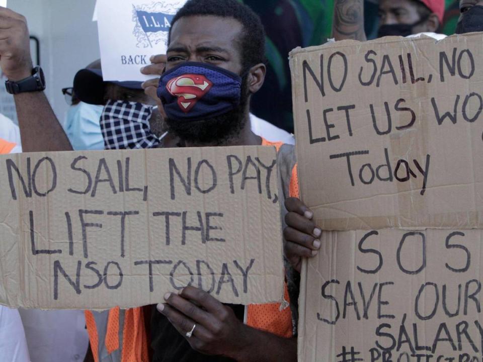 Miami, Florida, September 28, 2020-A protester holds a sign urging the end to the no-sail order. A group of longshoremen, travel agents and other professionals who depend on the cruise industry for employment held a rally at PortMiami Terminal D to urge the CDC to lift the no-sail order for cruising and allow the industry to restart.