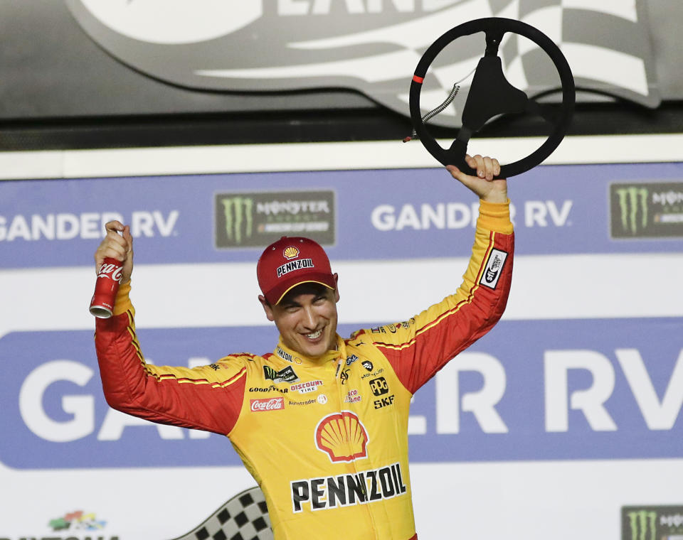 Joey Logano celebrates in Victory Lane after winning the second of two qualifying auto races for the NASCAR Daytona 500 at Daytona International Speedway, Thursday, Feb. 14, 2019, in Daytona Beach, Fla. (AP Photo/John Raoux)