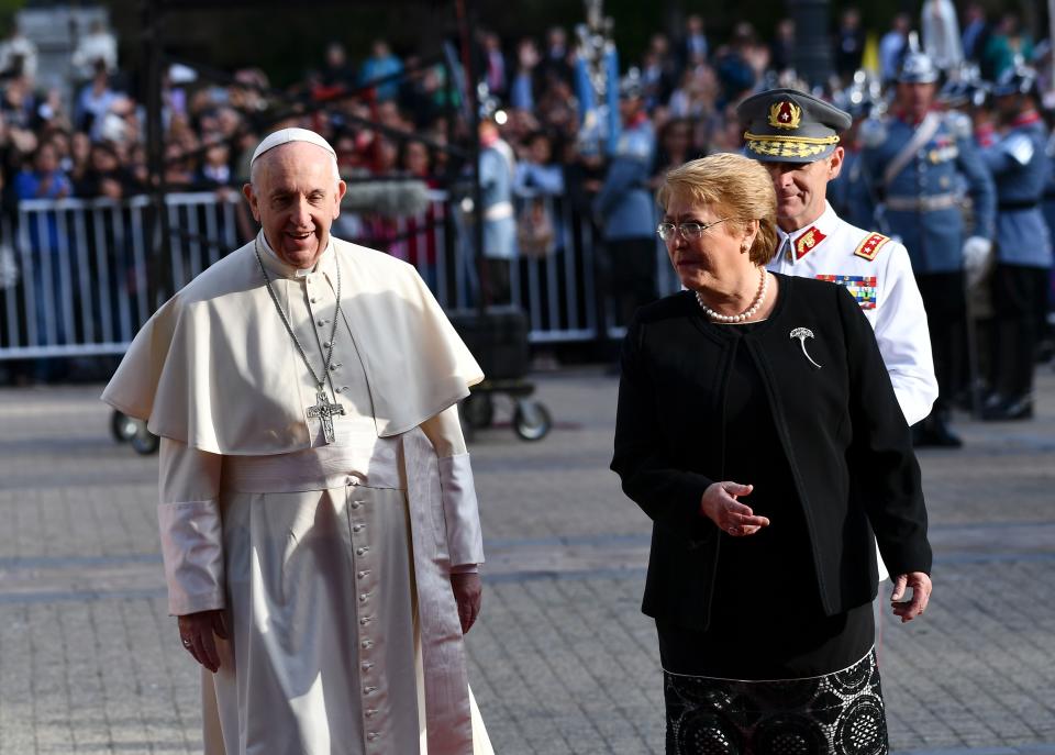 Pope Francis is welcomed by Chile's President Michelle Bachelet in Santiago on January 16, 2018.