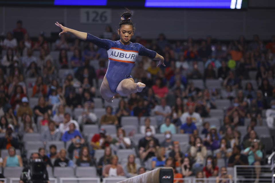 Auburn's Sunisa Lee competes on the balance beam during the NCAA college women's gymnastics championships, Saturday, April 16, 2022, in Fort Worth, Texas. (AP Photo/Gareth Patterson)