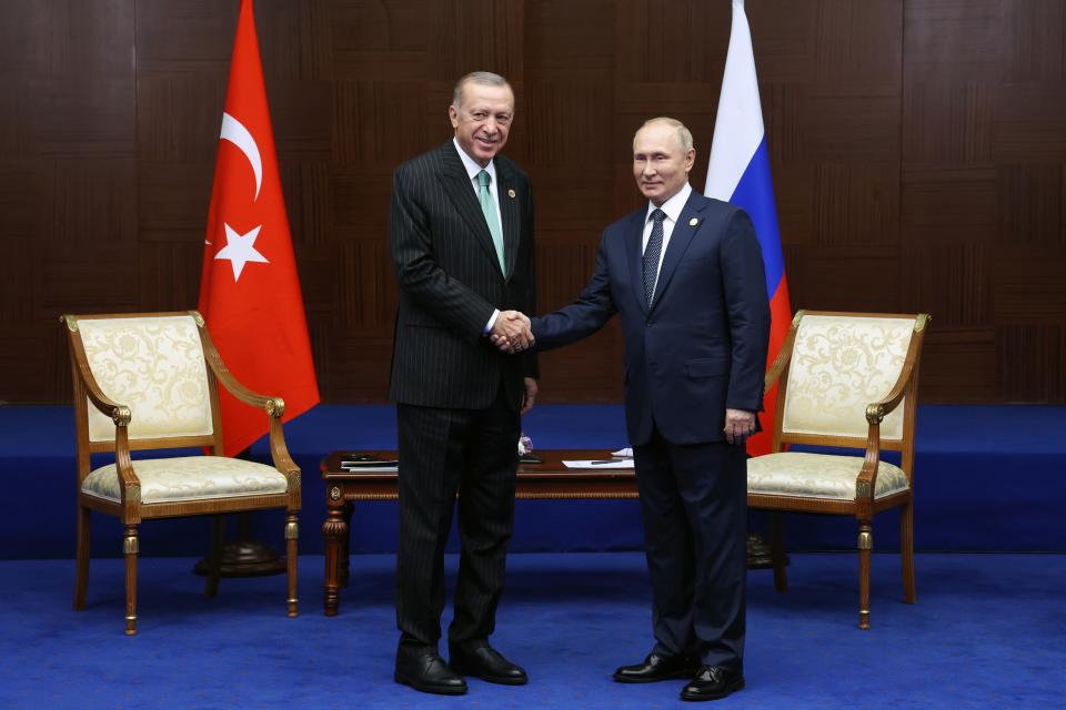 Russia's President Vladimir Putin, right, and Turkey's President Recep Tayyip Erdogan shake hands during their meeting on sidelines of the Conference on Interaction and Confidence Building Measures in Asia (CICA) summit, in Astana, Kazakhstan, Thursday, Oct. 13, 2022. (Vyacheslav Prokofyev, Sputnik, Kremlin Pool Photo via AP)