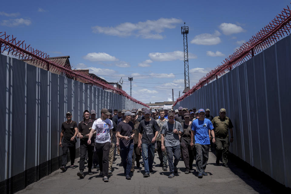 Prisoners go to lunch in a prison, in the Dnipropetrovsk region, Ukraine, Friday, June 21, 2024. Ukraine is expanding its military recruiting to cope with battlefield shortages more than two years into fighting Russia’s full-scale invasion. (AP Photo/Evgeniy Maloletka)