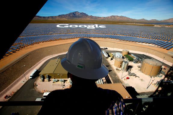 A worker standing on tower one at the Ivanpah Solar Electric Generating System looks over some of the mirrors tilted to form the Google logo, Feb. 13, 2014.