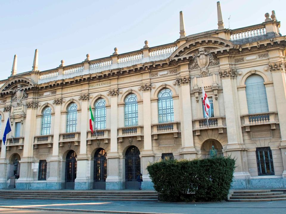 The Politechnico di Milano — a grand, old building with large windows.