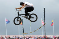 LONDON, ENGLAND - AUGUST 08: An exhibition rider jumps over a stick on Day 12 of the London 2012 Olympic Games at BMX Track on August 8, 2012 in London, England. (Photo by Bryn Lennon/Getty Images)