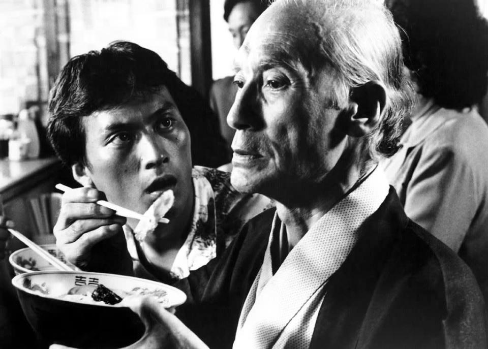 <a href="http://movies.yahoo.com/movie/tampopo/" data-ylk="slk:TAMPOPO;elm:context_link;itc:0;sec:content-canvas" class="link ">TAMPOPO</a> (1985) <br>Directed by: Juzo Itami <br>Starring: Tsutomu Yamazaki and Nobuko Miyamoto <br><br>Who would have thought that ramen noodles could be so funny? “Tampopo” is ostensibly about one widow’s dogged pursuit of the perfect bowl of noodles, aided by a craggy-faced Shane-like stranger, but director Juzo Itami casts his satirical net wide with a series of hilarious and perverse narrative digressions. From the scene in which the Man in the White Suit and his moll perform an unnatural act with a raw egg to the near pornographic slurping of pasta by a roomful of debutantes to an old woman who molests fruit in a grocery store, food, sex, and subversion all get hilariously woven together in this gleeful thumb in the eye of Japan's money-mad culture of the 1980s. --Jonathan Crow