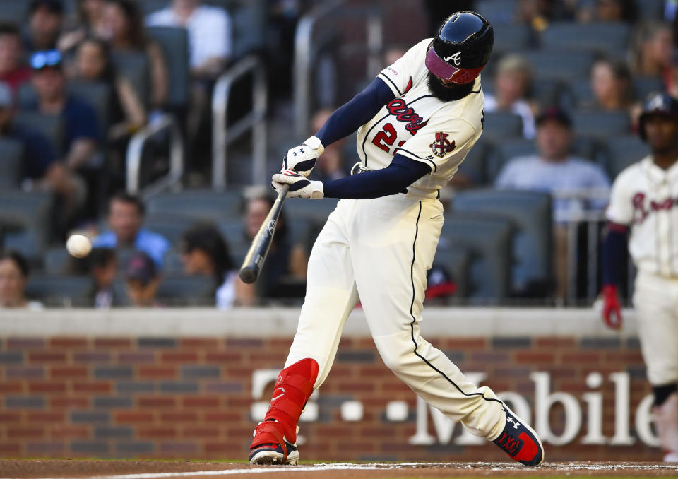 Atlanta Braves' Nick Markakis hits a two-run line drive single to right field during the first inning of a baseball game against the Washington Nationals, Sunday, July 21, 2019, in Atlanta. (AP Photo/John Amis)