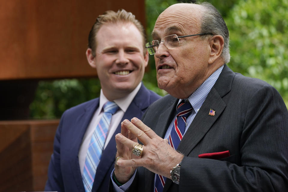 FILE - Andrew Giuliani, left, a Republican candidate for Governor of New York, is joined by his father, former New York City mayor Rudy Giuliani, during a news conference, June 7, 2022, in New York. One place the former New York City mayor is in high demand these days is on the campaign of his son, Andrew Giuliani, who on Tuesday is hoping to become the Republican nominee for governor of New York. (AP Photo/Mary Altaffer, File)