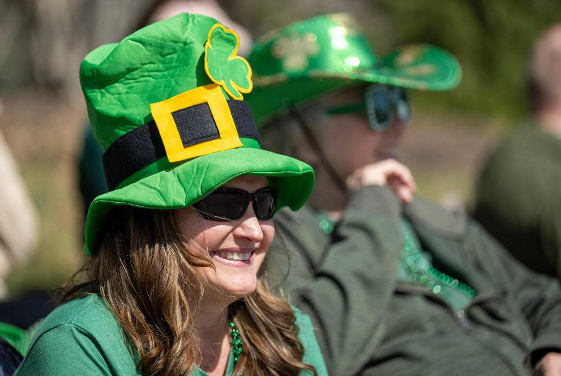 Julie Griswold of Overland Park donned her Irish hat as she sat along Johnson Drive and watched the annual Shawnee St. Patrick’s Day Parade on Sunday, March 10, 2024, in Shawnee.