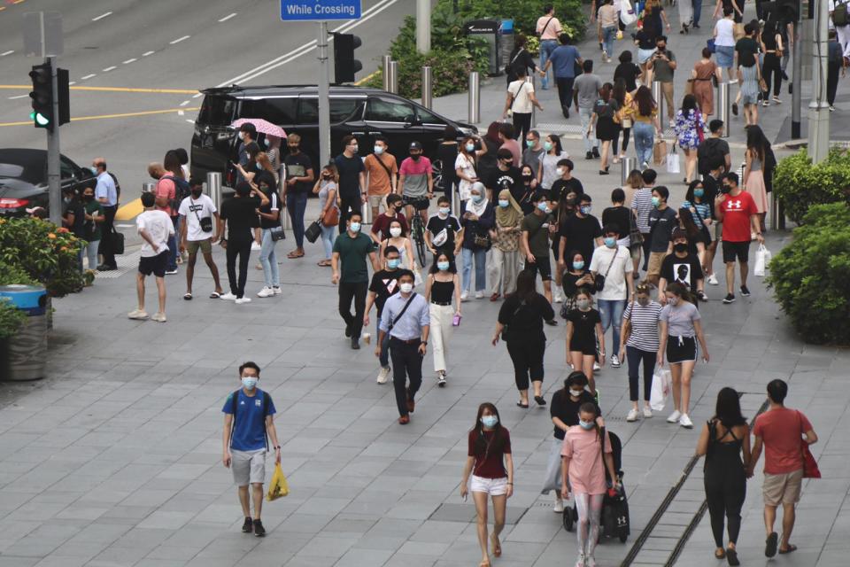 Human traffic along Orchard Road on 19 June, the first day of Singapore's Phase 2 reopening.(PHOTO:Yahoo News Singapore/Dhany Osman)