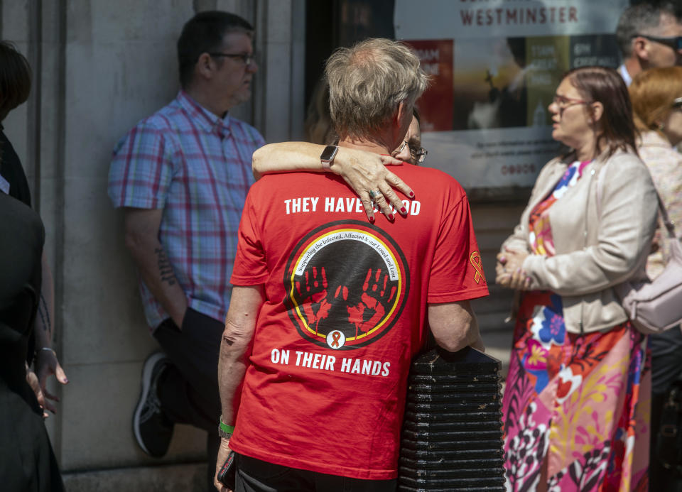 Victims and campaigners outside Central Hall in Westminster, London, after the publication of the Inquiry report. Tens of thousands of people in the UK were infected with deadly viruses after they were given contaminated blood and blood products between the 1970s and early 1990s. These include people who needed blood transfusions for accidents, in surgery or during childbirth, and patients with certain blood disorders who were treated with donated blood plasma products or blood transfusions. Picture date: Monday May 20, 2024. (Photo by Jeff Moore/PA Images via Getty Images)