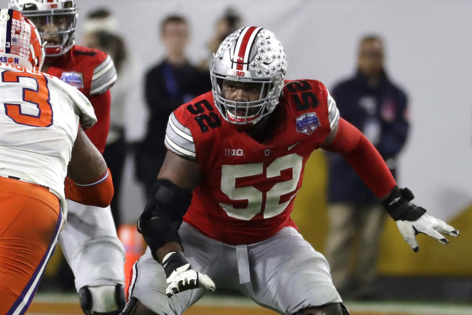 FILE - Ohio State offensive lineman Wyatt Davis (52) is shown during the first half of the Fiesta Bowl NCAA college football game against Clemson, Saturday, Dec. 28, 2019, in Glendale, Ariz. Ohio State stars Shaun Wade and Wyatt Davis got tired of waiting for a decision on the football season and chose to opt out and begin preparing for the NFL draft. “I should be in the middle of preparing for our game this week,” Davis said in his Twitter post Friday, Sept. 11, 2020. “Instead, due to the events of 2020, I spent the last weeks with my family and coaching staff trying to determine my future.” (AP Photo/Rick Scuteri, File)