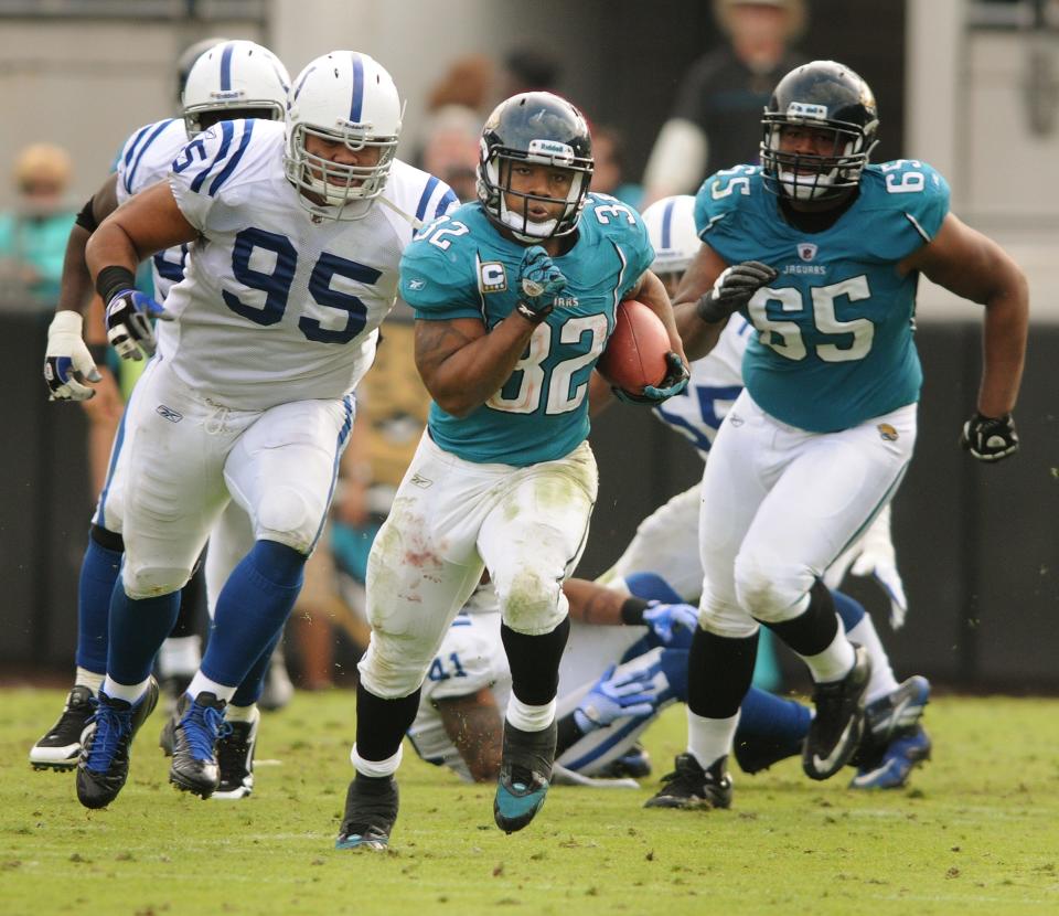 Jacksonville Jaguars running back Maurice Jones-Drew (32) runs for 56 yards as he breaks the team's single season rushing yard record just over 5 minutes into the third quarter against the Indianapolis Colts on January 1, 2012. It was also the final game for the former owners of the Jaguars Wayne Weaver and Delores Barr Weaver. [Kelly Jordan/Florida Times-Union]