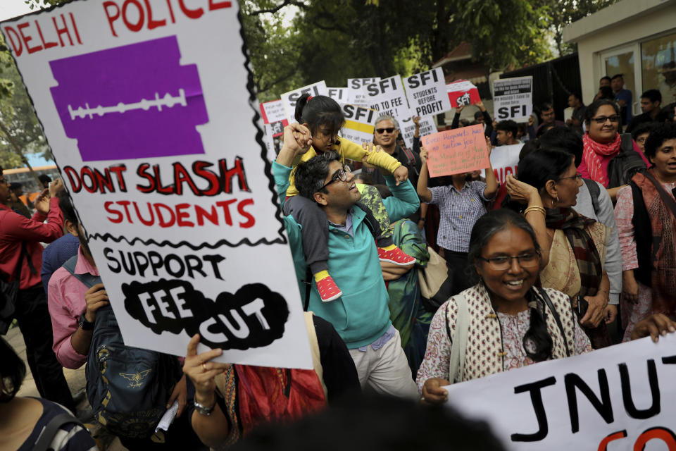 Members Jawaharlal Nehru University Teachers' Association march in support of Indian students during a protest march towards the Parliament in New Delhi, India, Saturday, Nov. 23, 2019. Hundreds of students of the Jawahar Lal Nehru University were joined by students from other universities, activists and members of civil society as they marched towards India's parliament to protest against the hostel fee hike, along with their other demands. (AP Photo/Altaf Qadri)