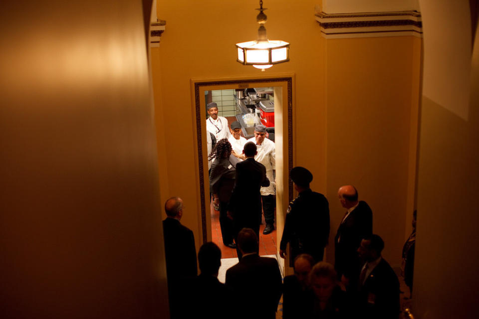 Obama greets kitchen staff before&nbsp;a lunch at the U.S. Capitol on Jan. 27, 2009.