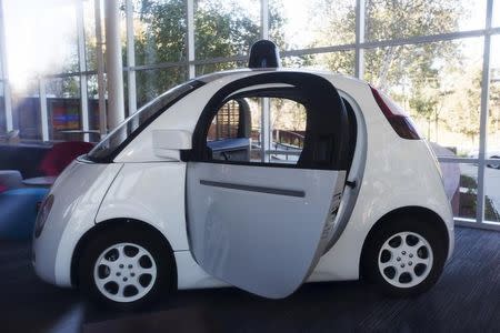 A Google self-driving car is seen inside a lobby at the Google headquarters in Mountain View, California November 13, 2015. REUTERS/Stephen Lam