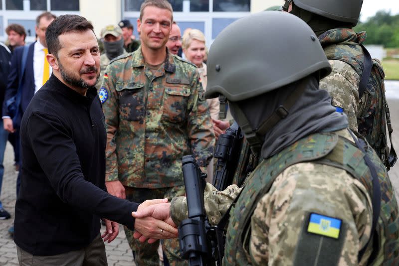 FILE PHOTO: Ukrainian President Volodymyr Zelenskiy visit to a military training area