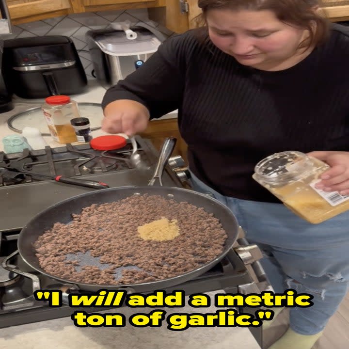 a tiktok creator spooning garlic from a container into a pan