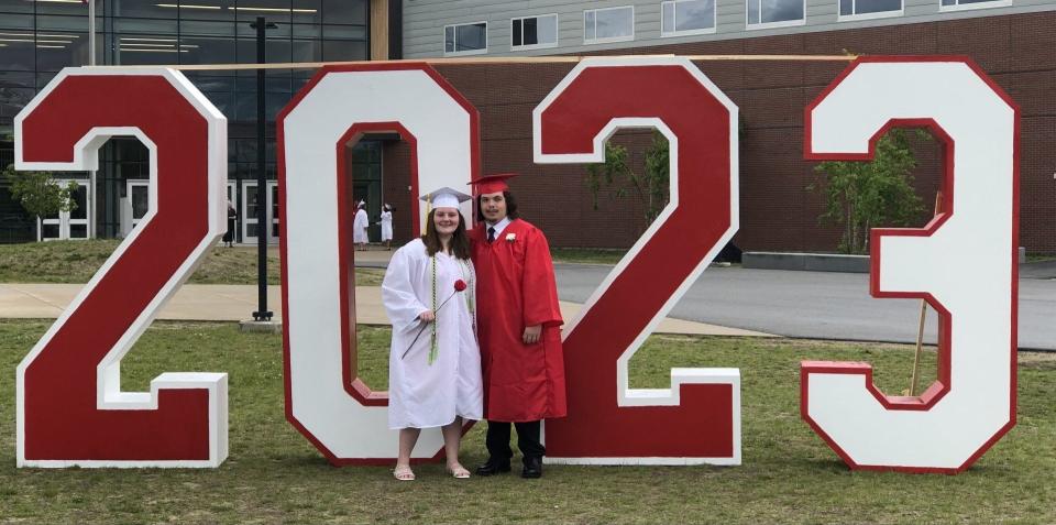 Summer Clough, left, and Danien Lirette pose with the year that for them will always be the one in which they graduated from Sanford High School on Wednesday, June 7, 2023.