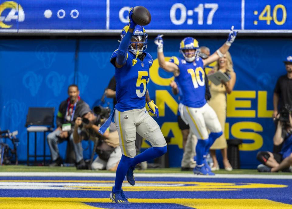 Cooper Kupp (10) celebrates a touchdown catch by Rams teammate Tutu Atwell (5) against the Steelers.