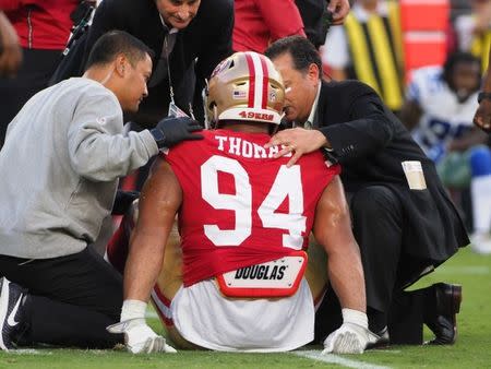 Aug 9, 2018; Santa Clara, CA, USA; Staff attend to San Francisco 49ers defensive end Solomon Thomas (94) after a play against the Dallas Cowboys during the first quarter at Levi's Stadium. Mandatory Credit: Kelley L Cox-USA TODAY Sports