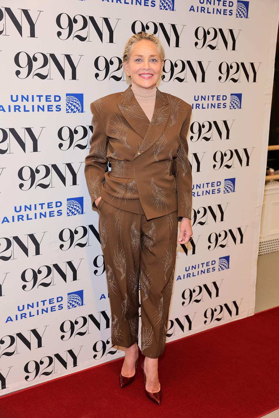 Sharon Stone, art, burgundy pumps, leather, Tod's, suit, New York.