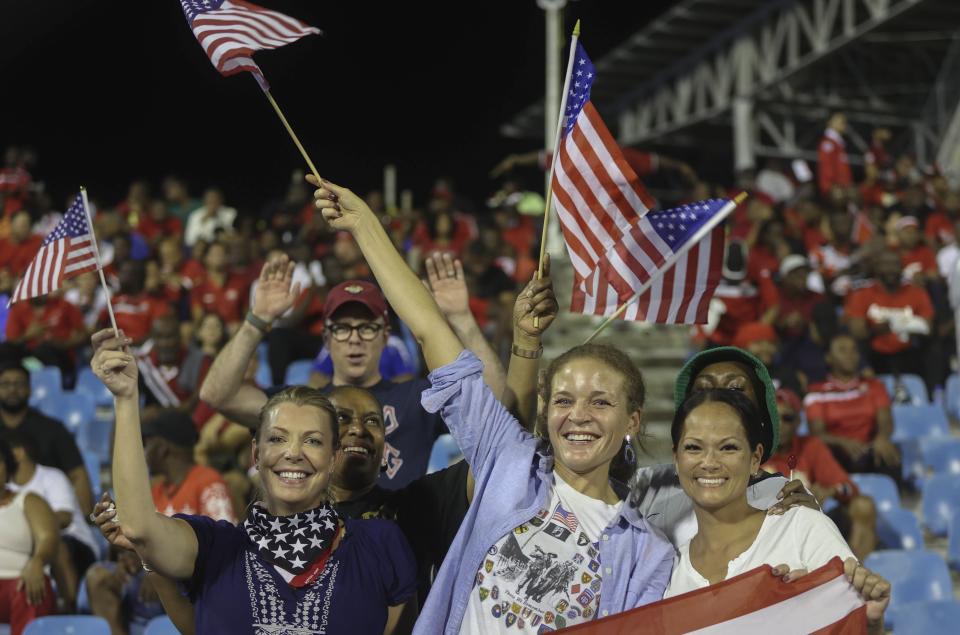 United States supporters cheer during a game against Trinidad and Tobago at a CONCACAF Nations League quarterfinals soccer match at Hasely Crawford Stadium in Port of Spain, Trinidad and Tobago, Monday, Nov. 20, 2023. (AP Photo/Azlan Mohammed)