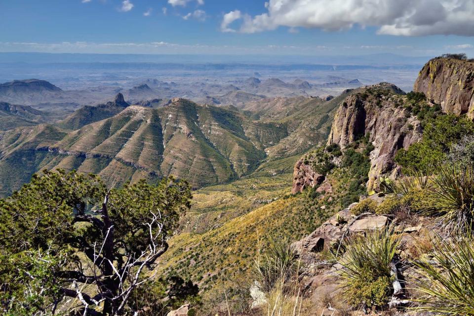 Blue Skies and Clouds Above the Peaks and Mountainsides of the Chisos Mountains on the South Rim Trail in Big Bend National Park