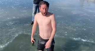 Jason Clarke emerges from a frozen lake in Utah.