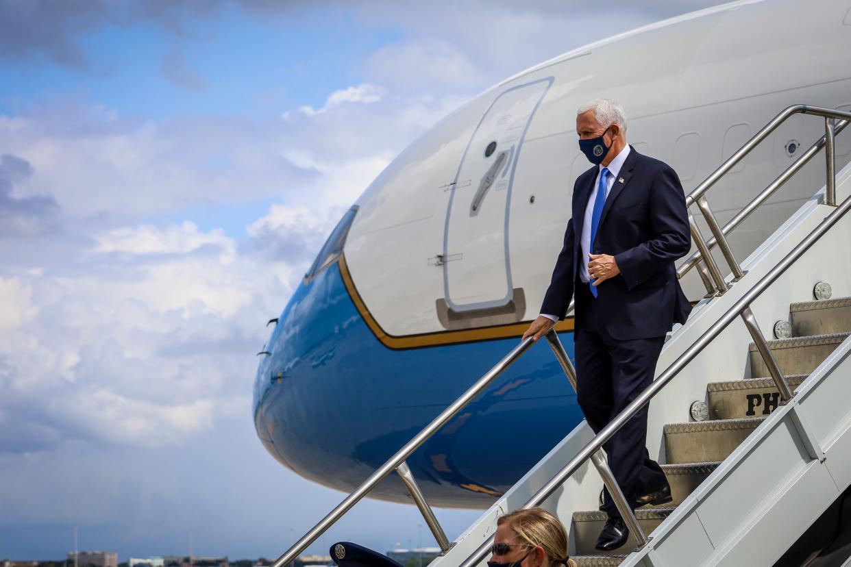 Mike Pence is pictured arriving in Orlando on Saturday for a series of rallies in the vital swing state  (Zak BENNETT/AFP via Getty Images)