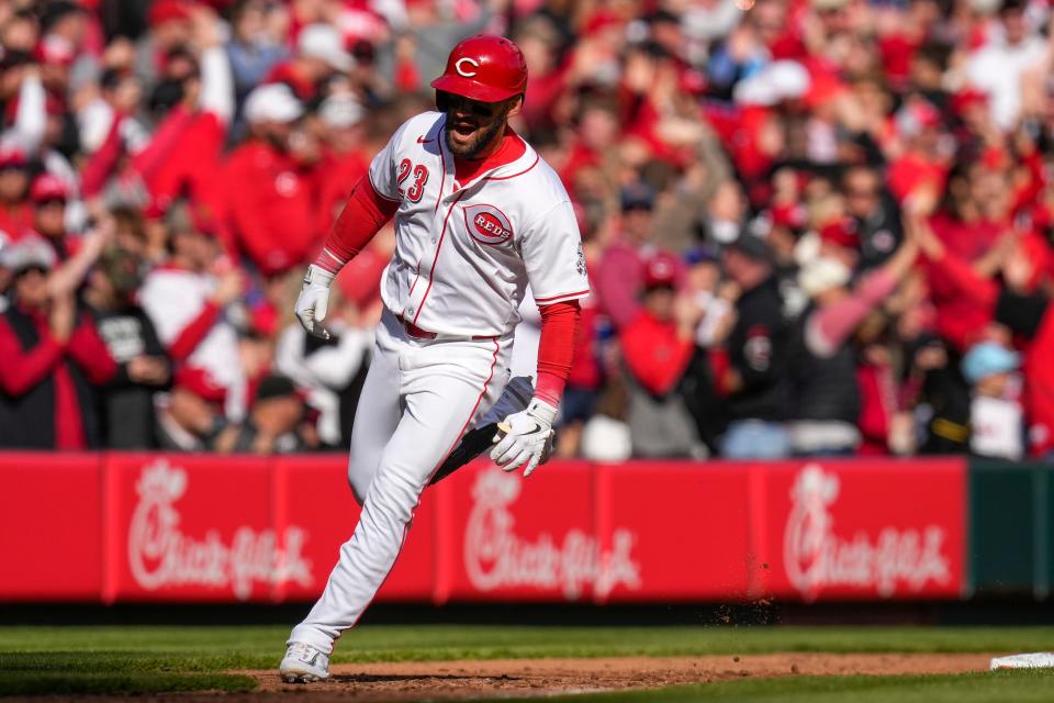 Cincinnati Reds designated hitter Nick Martini (23) rounds third base on his second home run of the game in the third inning of the MLB National League Opening Day game between the Cincinnati Reds and the Washington Nationals at Great American Ball Park in downtown Cincinnati on Thursday, March 28, 2024.