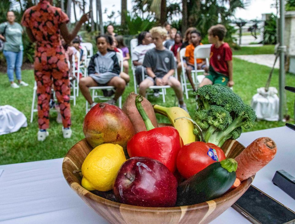 Second graders from The Conservatory School prepare to play a game called Eat the Rainbow during the Earth Day Celebration at Ann Norton Sculpture Gardens on Monday.