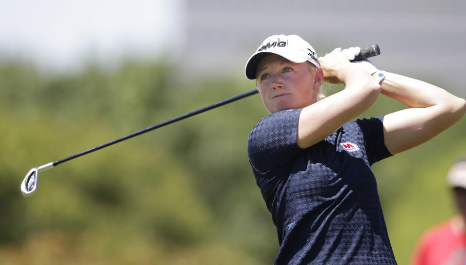 Stacy Lewis watches her tee shot on the 11th hole during the third round of the North Texas LPGA Shootout golf tournament at Las Colinas Country Club in Irving, Texas, Saturday, May 3, 2014. (AP Photo/LM Otero)